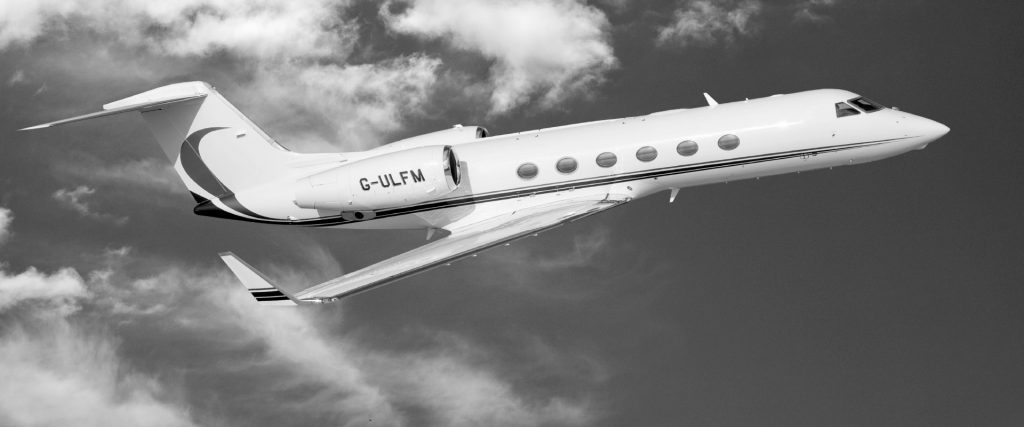 Gulfstream Jet in flight. Dramatic black and white image.