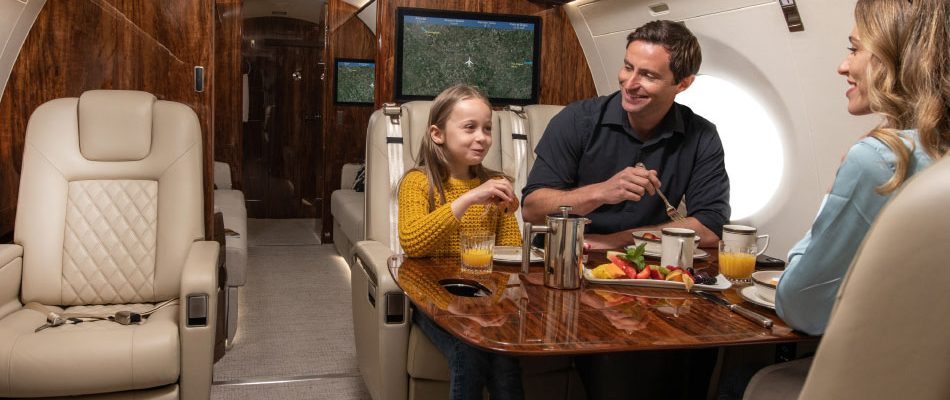 Family enjoying a meal during a flight